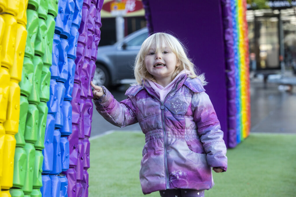  Charlotte Rycraft, age 2, has fun under the #EveryCanCounts rainbow.