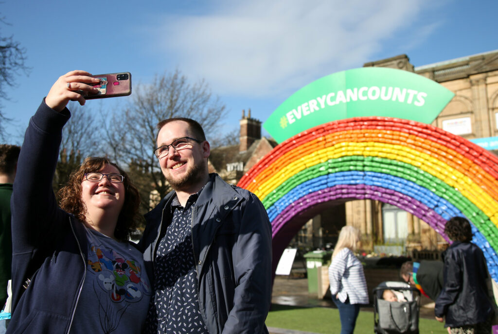 Lucy Wollhouse and Adam Care take a selfie in front of the #EveryCanCounts Rainbow in York. 