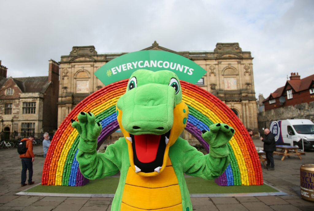 The Snappy Croc (Snappy Trust mascot) in front of the #EveryCanCounts Rainbow in York.